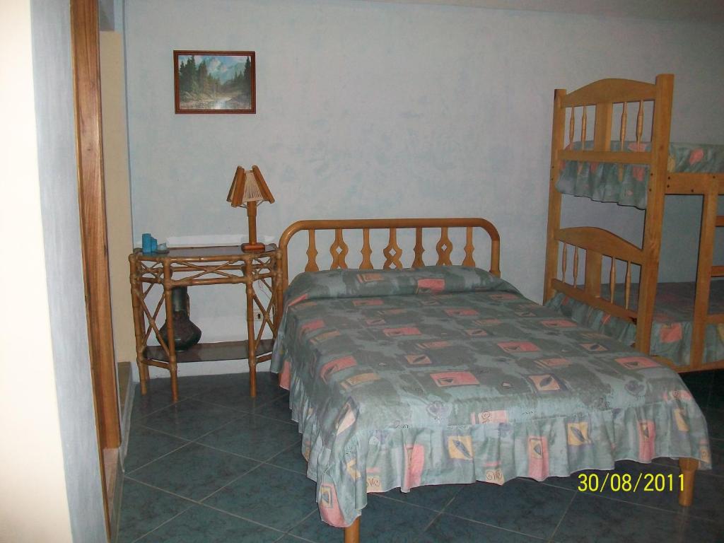 Postel nebo postele na pokoji v ubytování Hostal Cabañas Vistamar