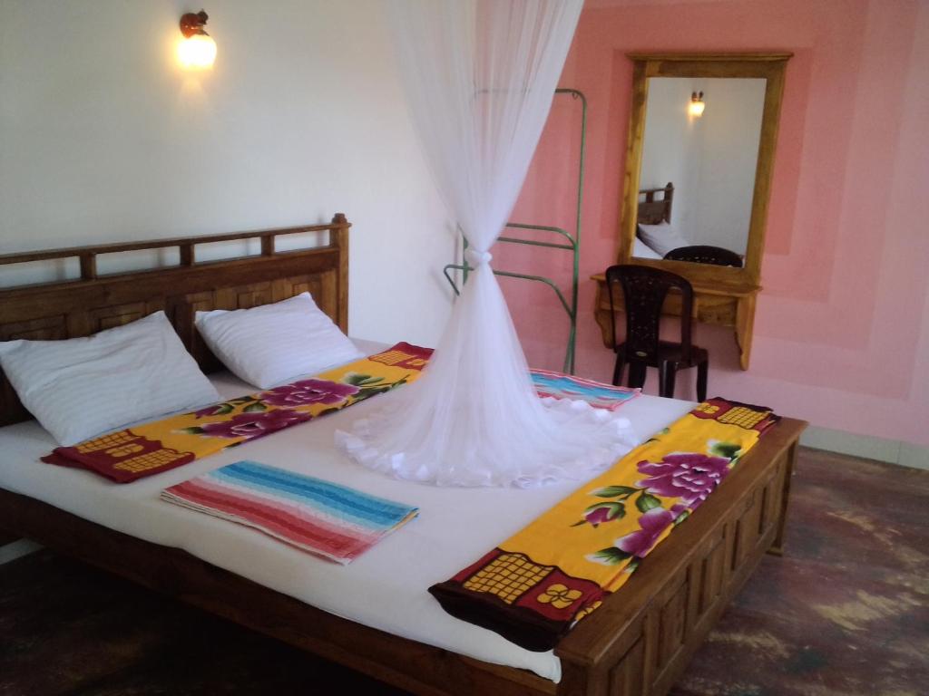 Postel nebo postele na pokoji v ubytování Jaye Homestay