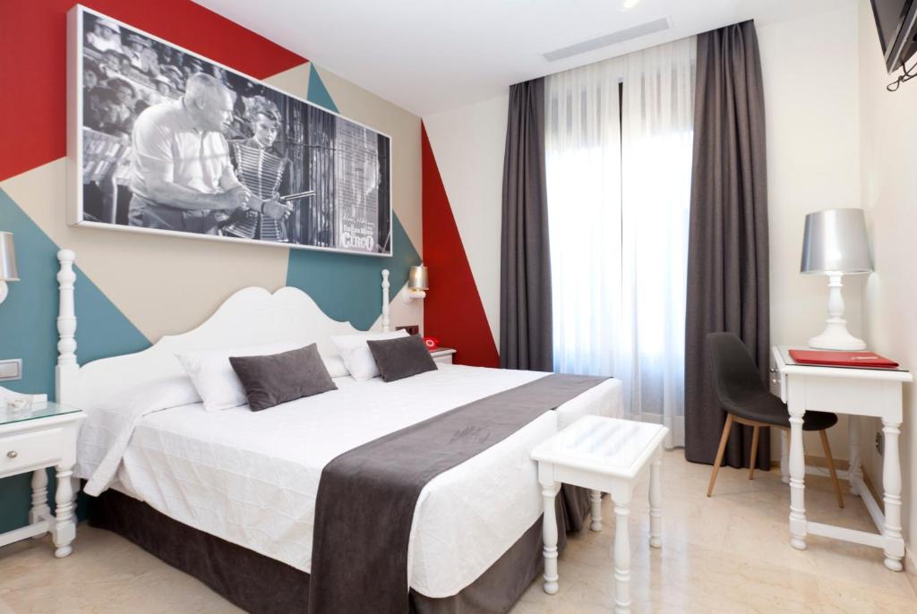 Postel nebo postele na pokoji v ubytování Hotel Carlos V