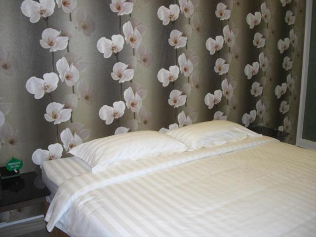 Postel nebo postele na pokoji v ubytování Marvelot Hotel