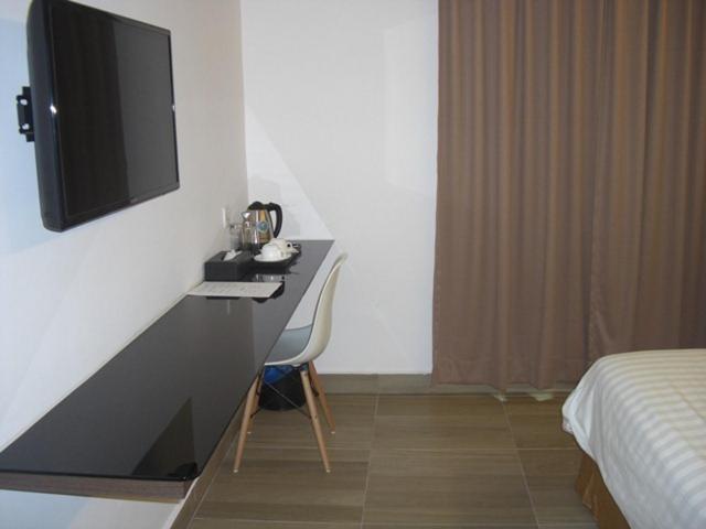 TV a/nebo společenská místnost v ubytování Marvelot Hotel