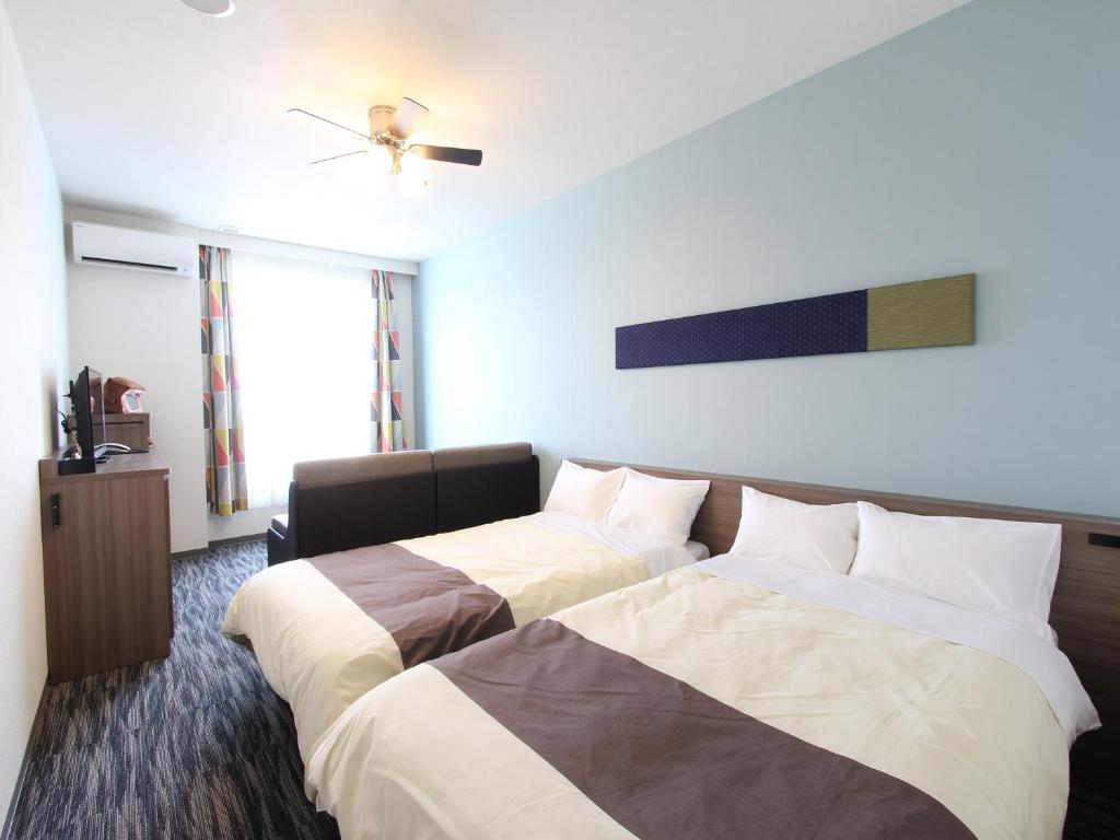 Voodi või voodid majutusasutuse Henn na Hotel Laguna Ten Bosch toas