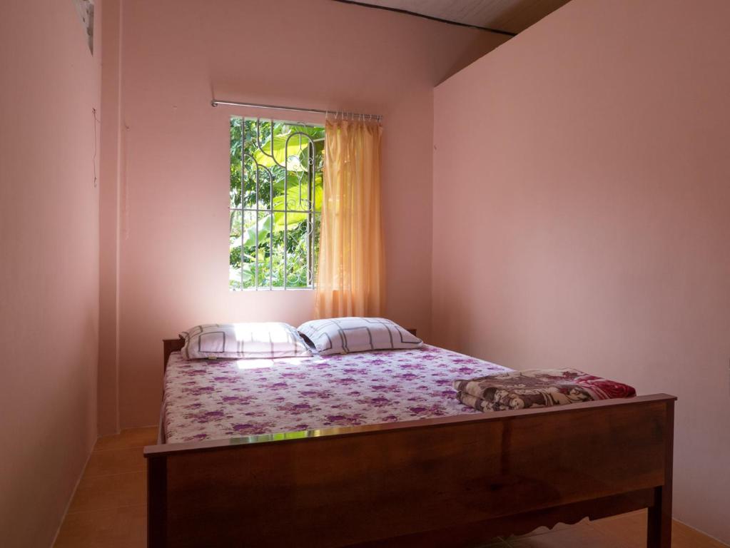 Postel nebo postele na pokoji v ubytování Happy Homestay