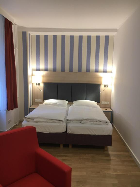 Postel nebo postele na pokoji v ubytování Hotel Hansablick
