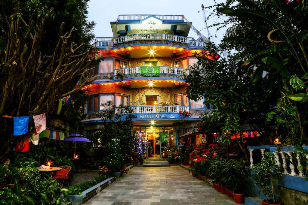 a building with a walkway in front of it at Hotel Silver Oaks Inn in Pokhara