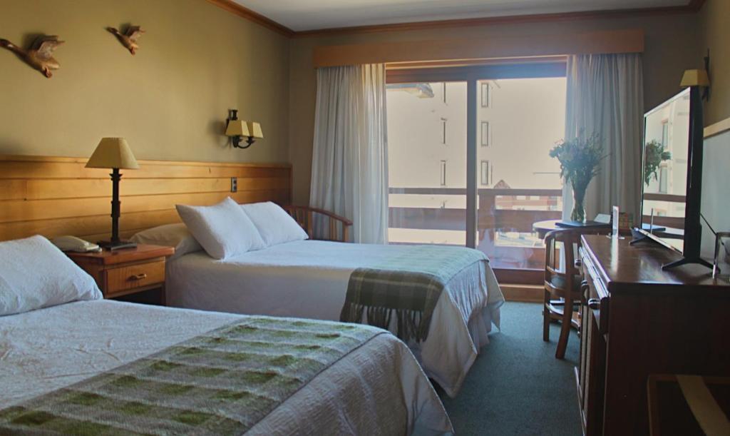 Cama o camas de una habitación en Hotel Puelche