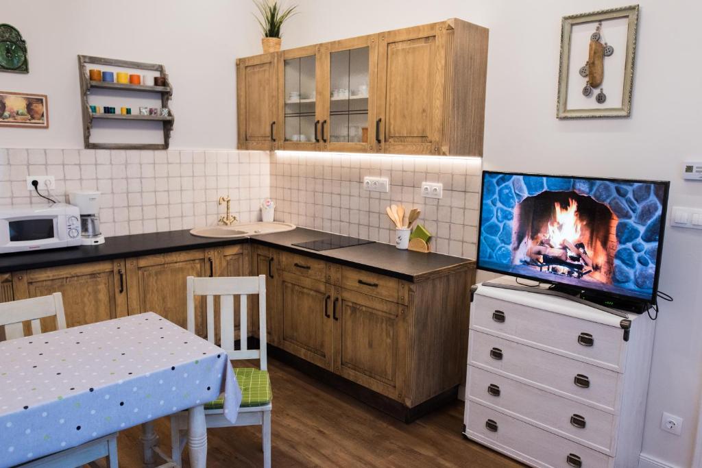 Kuchyňa alebo kuchynka v ubytovaní All In Apartman II.