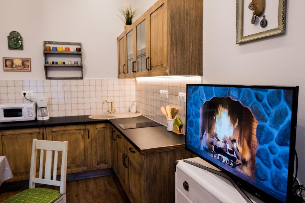 Kuchyňa alebo kuchynka v ubytovaní All In Apartman II.
