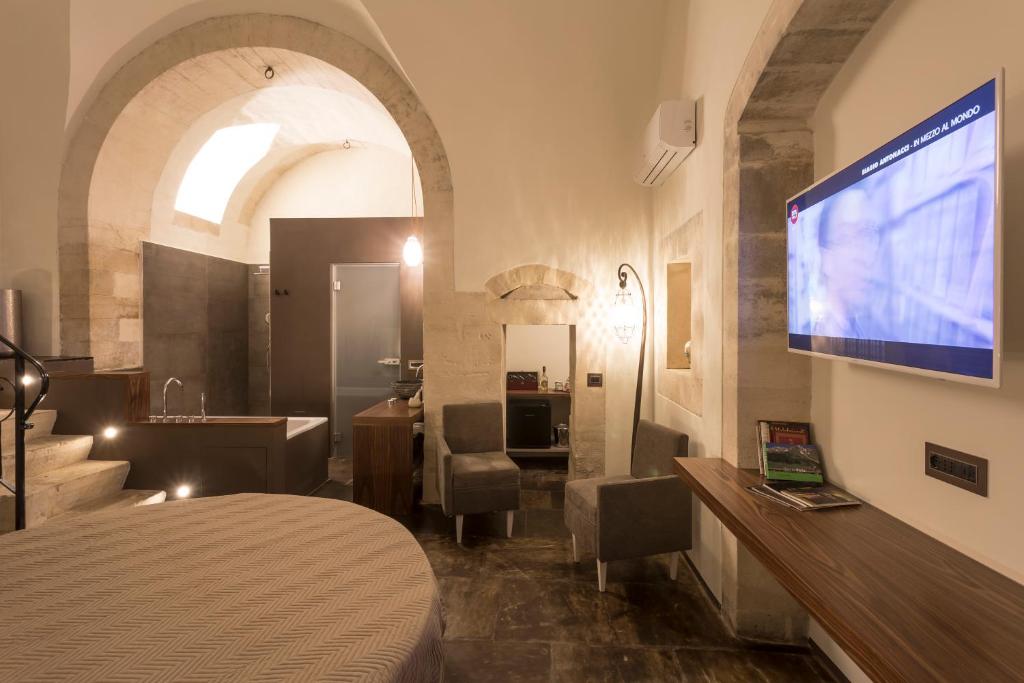 TV a/nebo společenská místnost v ubytování B&B Giardino Di Pietra
