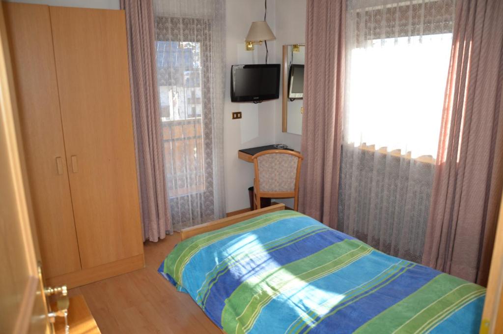 Łóżko lub łóżka w pokoju w obiekcie Hotel Centrale