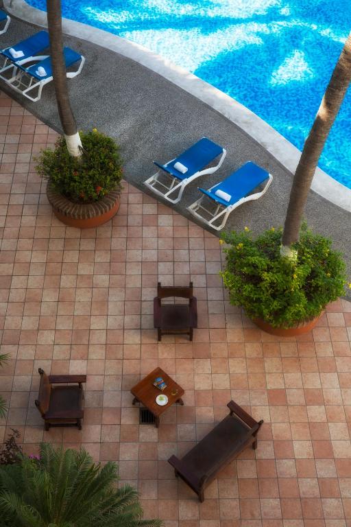 Bazén v ubytování Hotel El Pescador nebo v jeho okolí