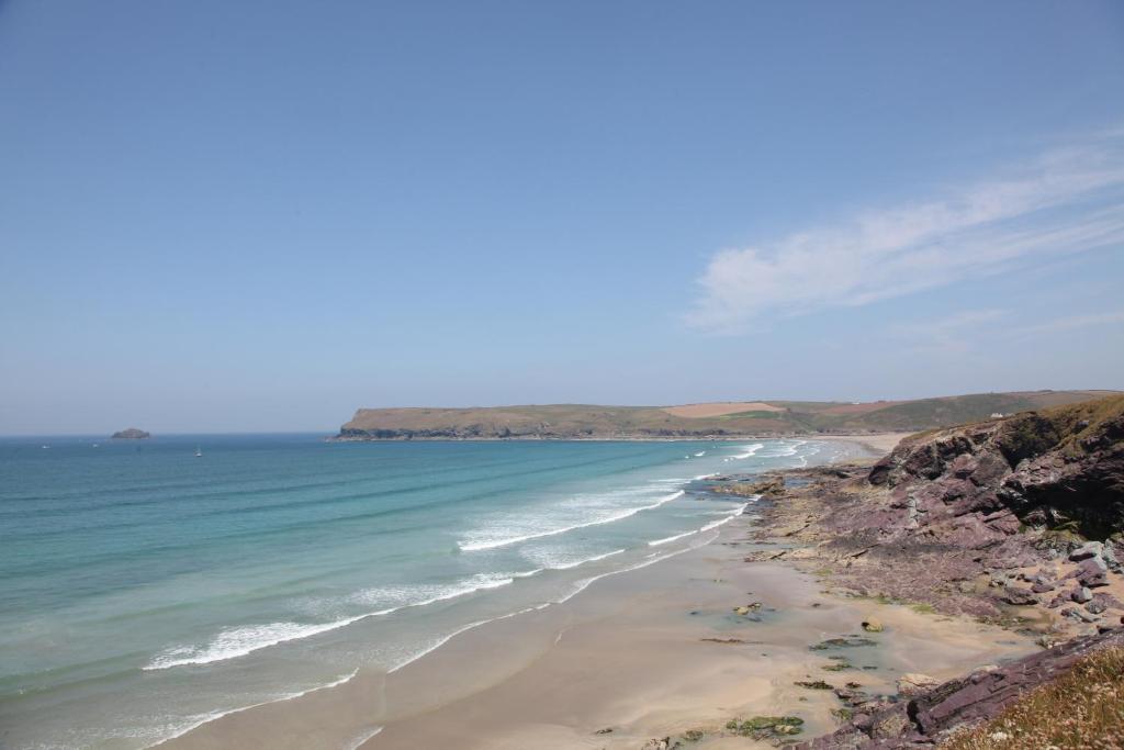 a view of a beach with the ocean at St Moritz Hotel and Cowshed Spa in Polzeath