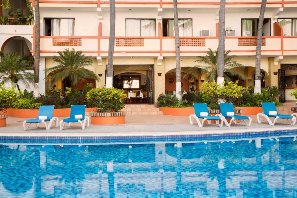 Bazén v ubytování Hotel El Pescador nebo v jeho okolí
