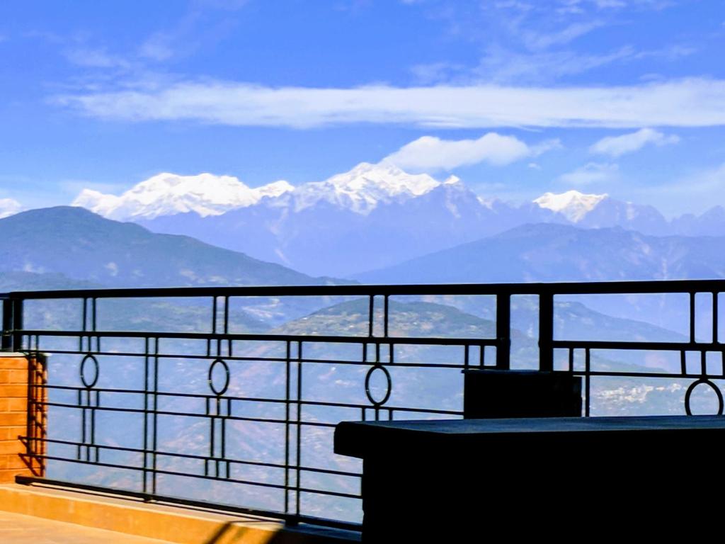 a balcony with a view of the mountains at Yuru Retreat Delo in Kalimpong