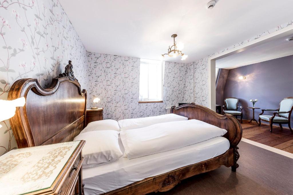 Postel nebo postele na pokoji v ubytování Hotel Terrasse am See