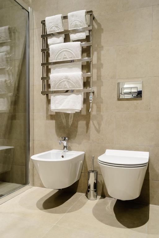 Koupelna v ubytování Albes Hotel