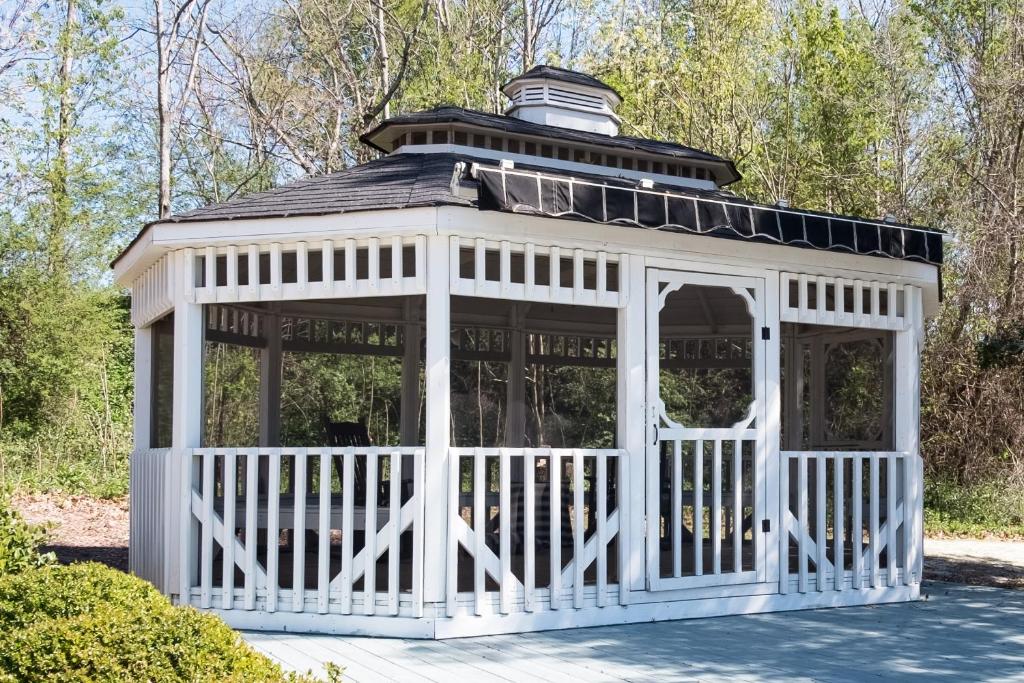 a white gazebo with a black roof at Swamp Rabbit Inn Travelers Rest in Travelers Rest