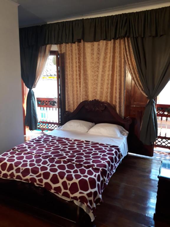 Cama o camas de una habitación en Bonsai Hotel Salamina Caldas