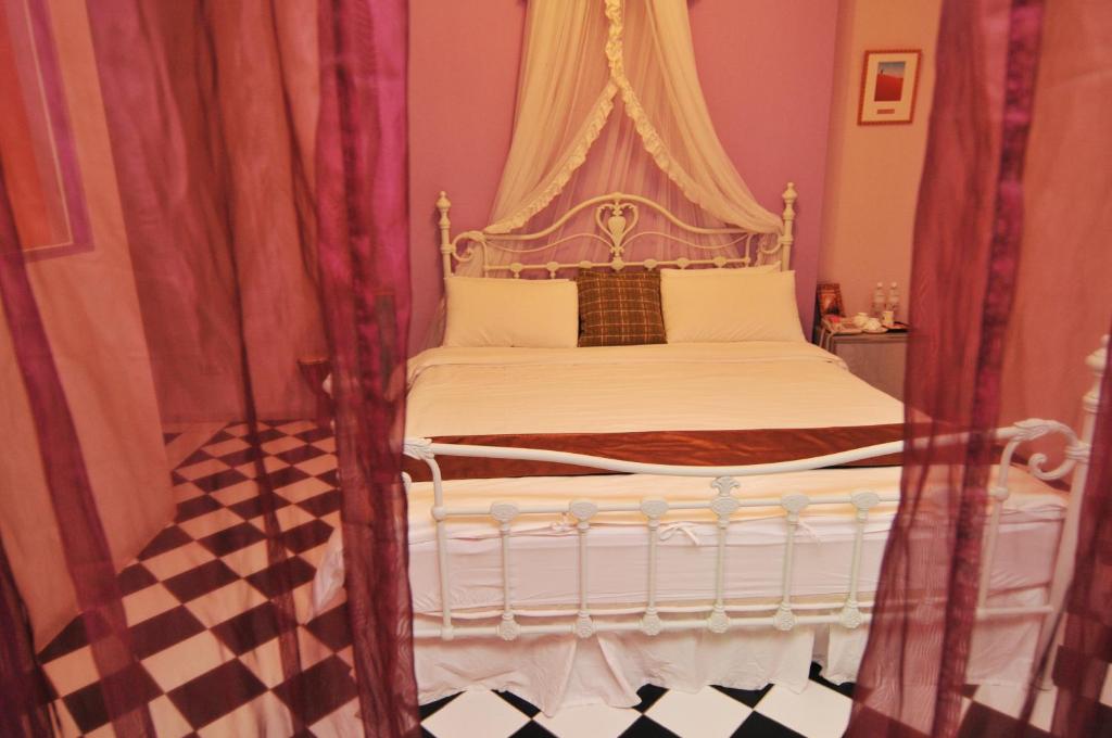 Postel nebo postele na pokoji v ubytování Raid Garden Boutique Hotel