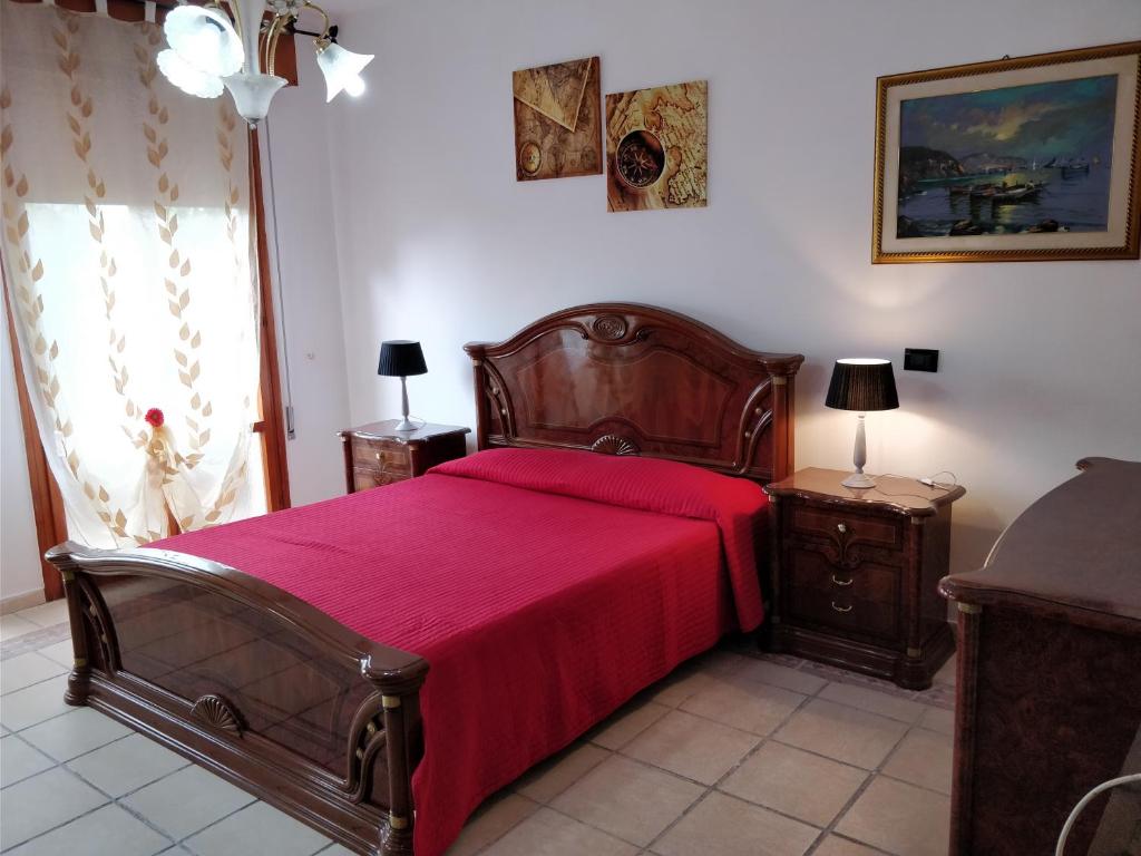 Postel nebo postele na pokoji v ubytování B&B Le Palme d'Oro