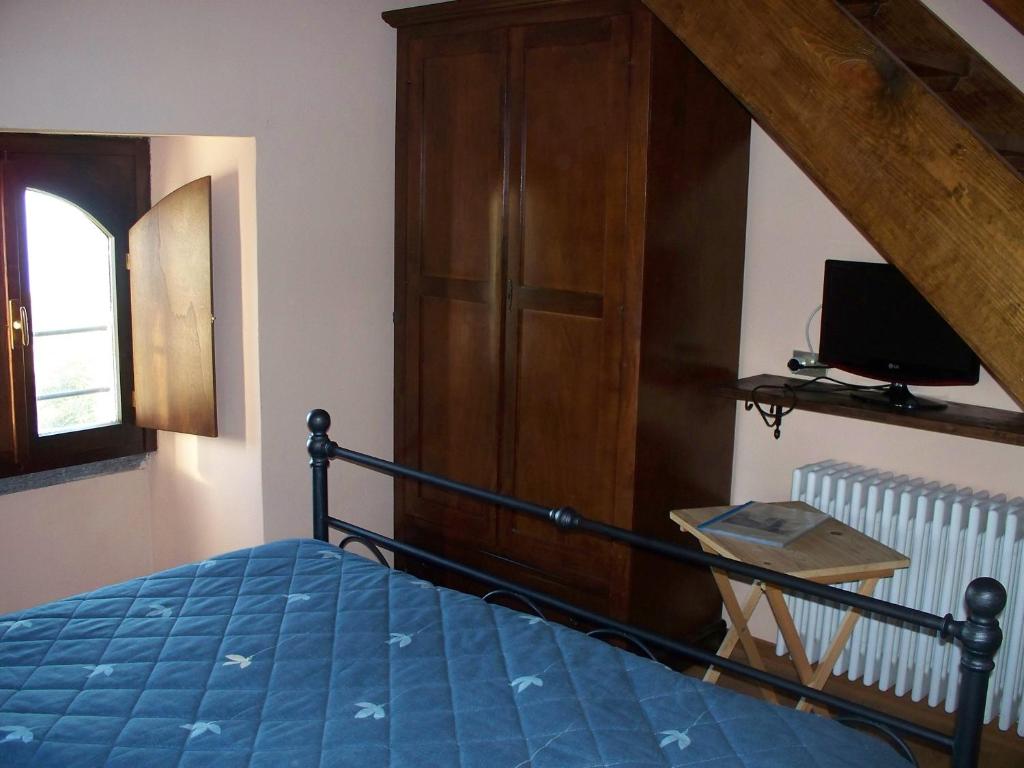 A bed or beds in a room at Agriturismo Monterosso