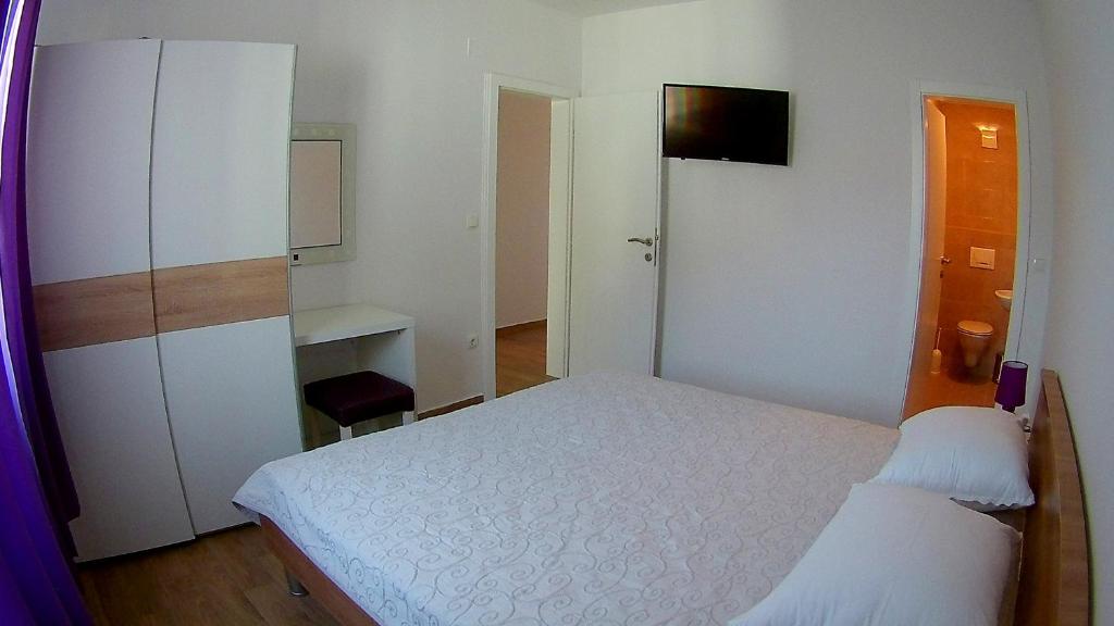 Postel nebo postele na pokoji v ubytování Apartments Tea