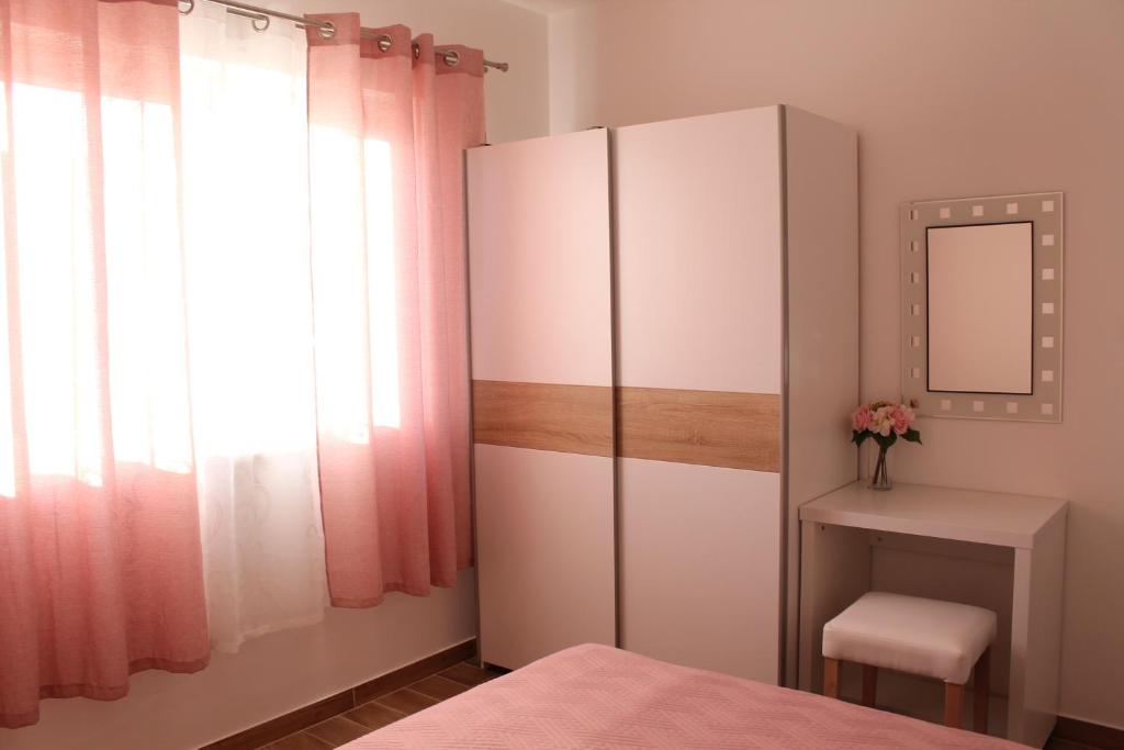 Postel nebo postele na pokoji v ubytování Apartments Tea