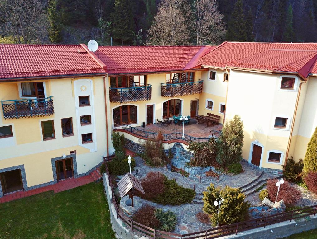 an aerial view of a building with a yard at Penzión Salamander in Mlynky 