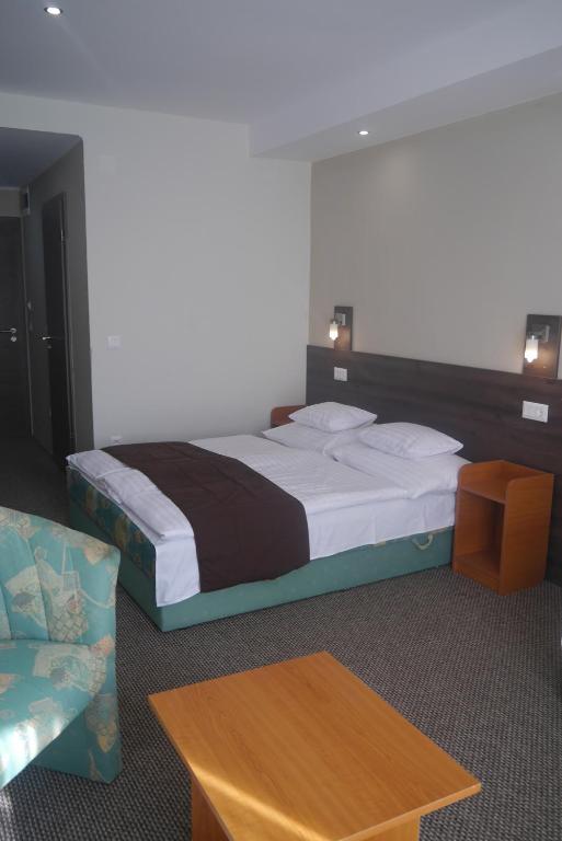Postel nebo postele na pokoji v ubytování Hotel Tagore