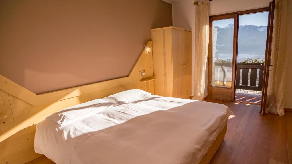Postel nebo postele na pokoji v ubytování Hotel Garni Edy