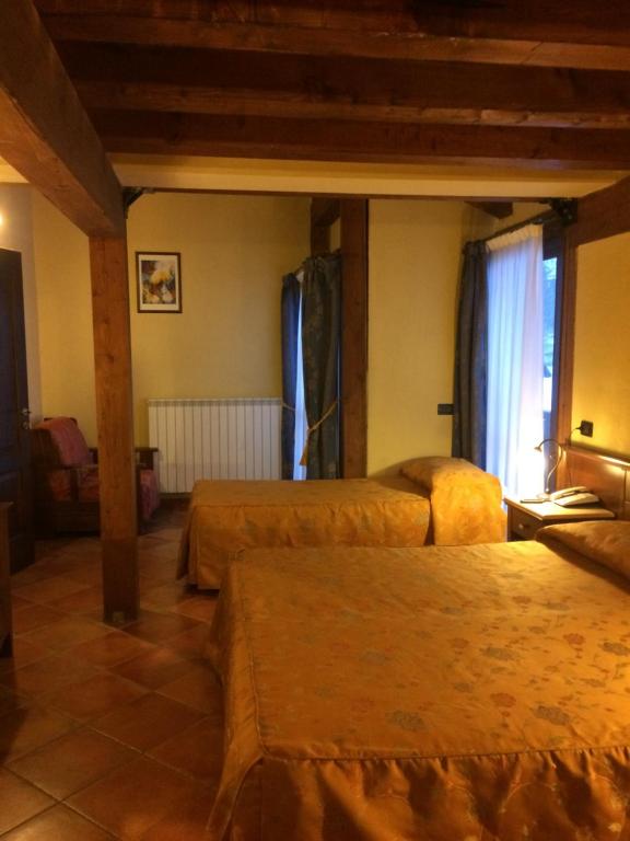Postel nebo postele na pokoji v ubytování Hotel Cà Fiore
