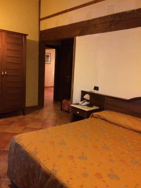 Postel nebo postele na pokoji v ubytování Hotel Cà Fiore