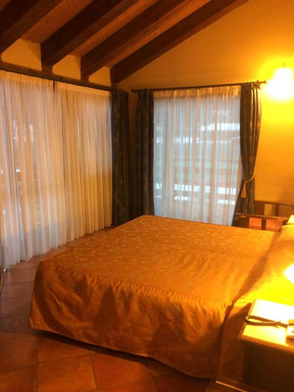 Postel nebo postele na pokoji v ubytování Hotel Cà Fiore