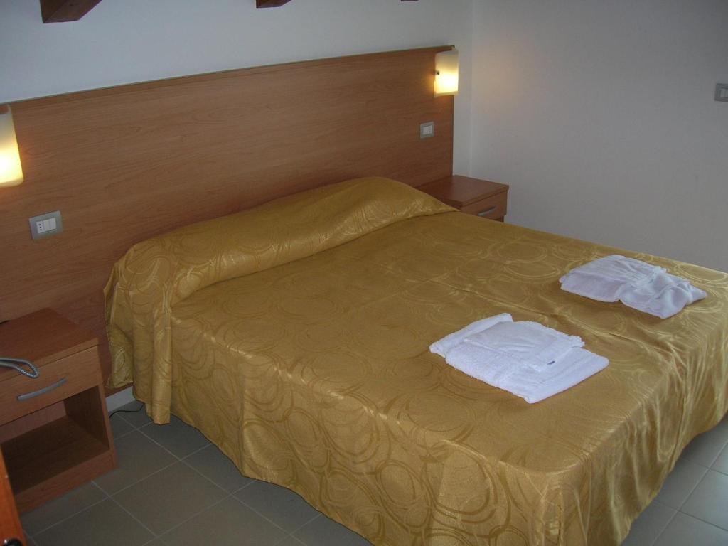 Postel nebo postele na pokoji v ubytování Casa Del Mar