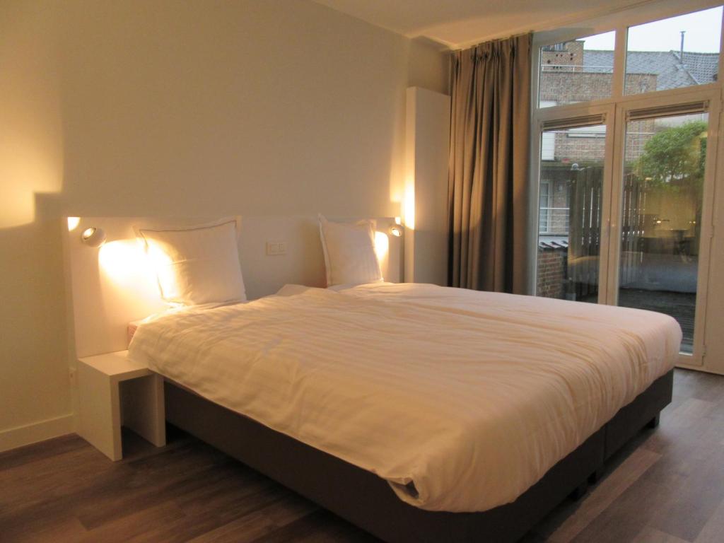 Postel nebo postele na pokoji v ubytování Hotel Muske Pitter
