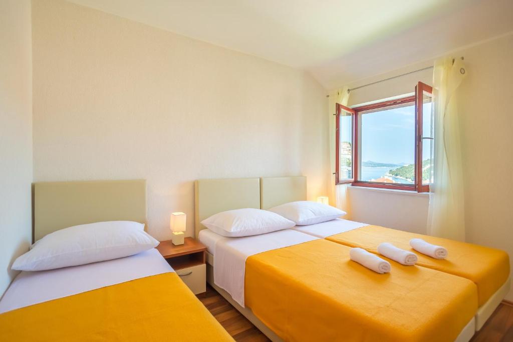 Posteľ alebo postele v izbe v ubytovaní Niki Apartment