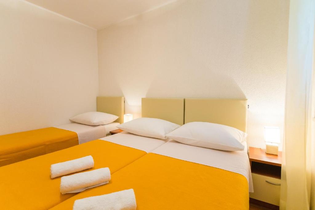 Posteľ alebo postele v izbe v ubytovaní Niki Apartment