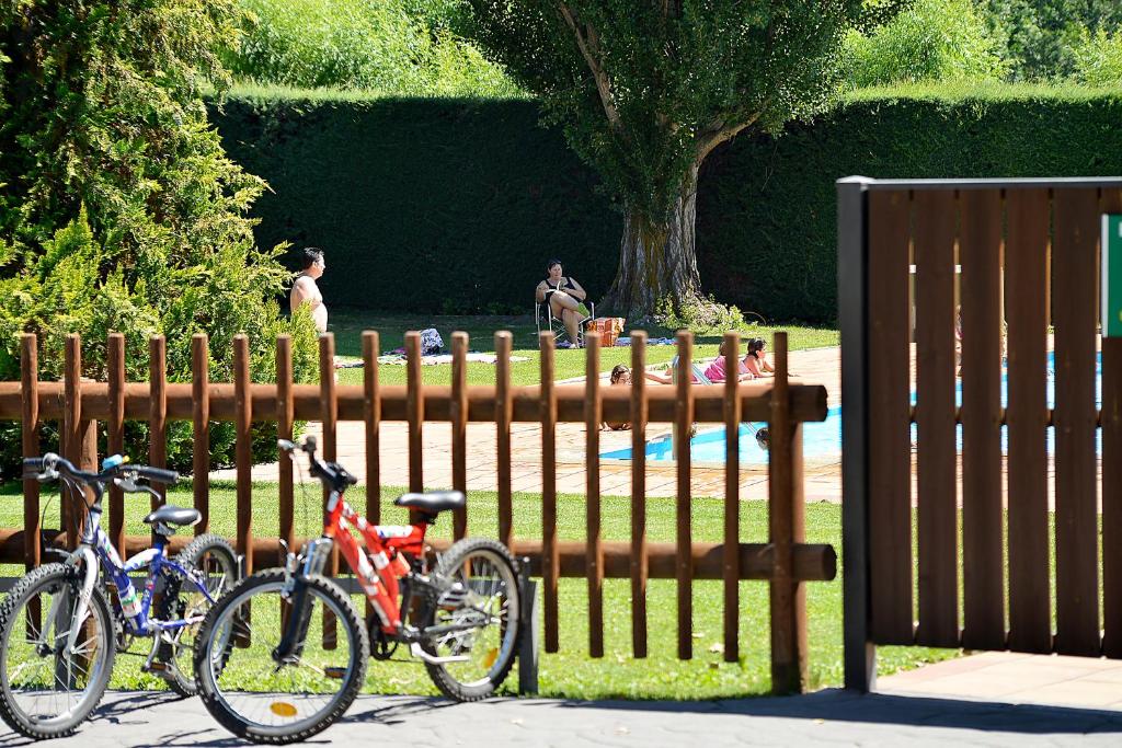 a group of bikes parked next to a fence at Bungalows Stel-Puigcerdà in Puigcerdà