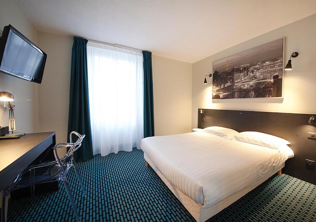 Postel nebo postele na pokoji v ubytování CIT'HÔTEL LE DAV Clermont-Ferrand Centre