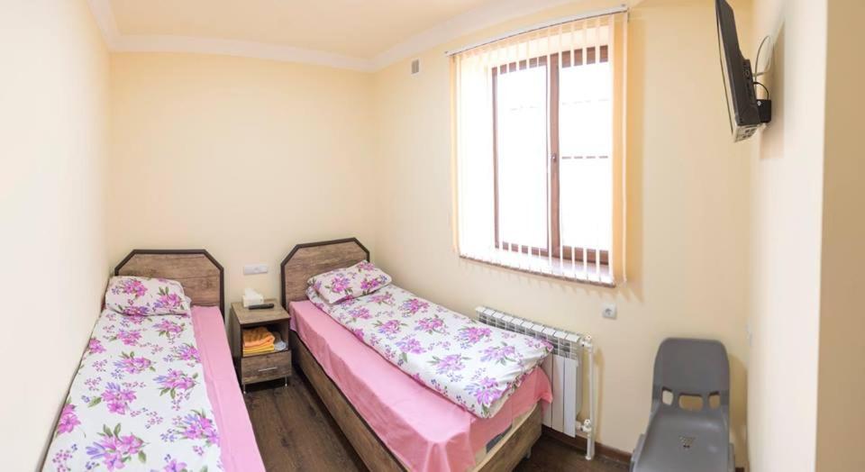 Postel nebo postele na pokoji v ubytování Hotel Amaras