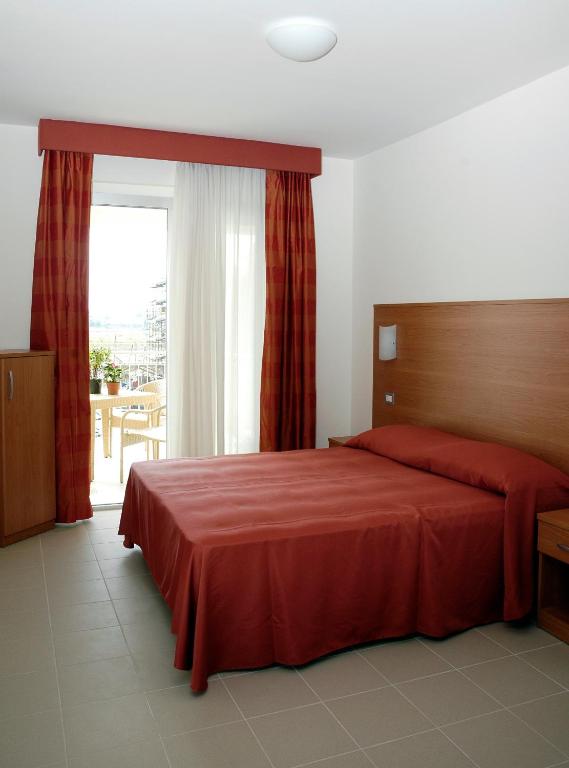 Postel nebo postele na pokoji v ubytování Casa Del Mar