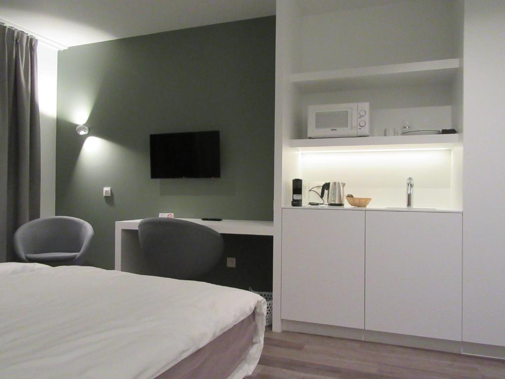 Kuchyň nebo kuchyňský kout v ubytování Hotel Muske Pitter