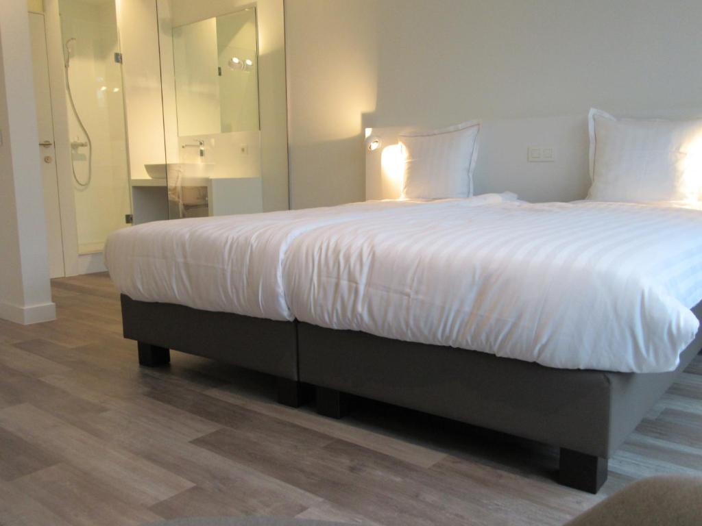 Postel nebo postele na pokoji v ubytování Hotel Muske Pitter