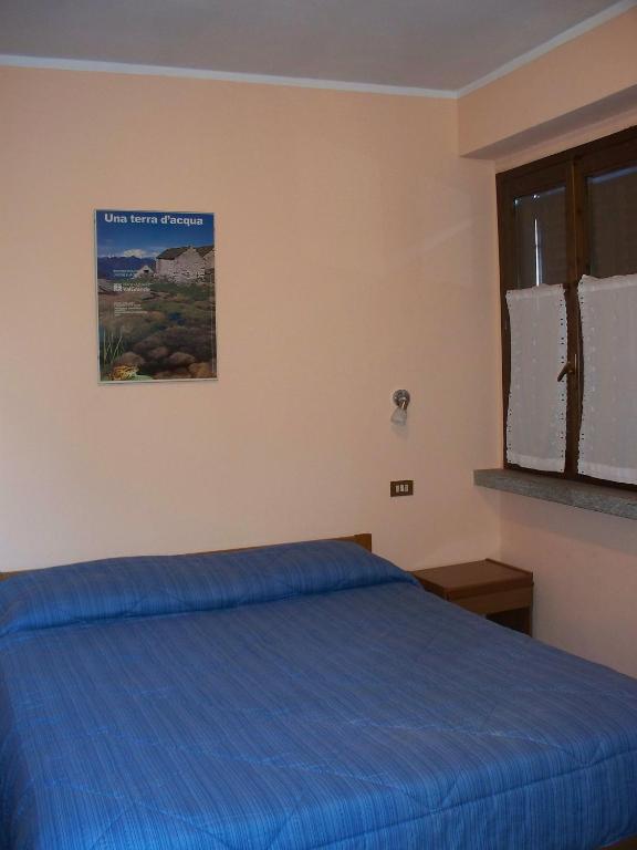 A bed or beds in a room at Agriturismo Monterosso