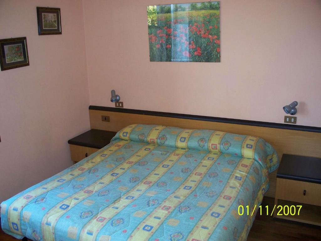 A bed or beds in a room at Agriturismo Monterosso