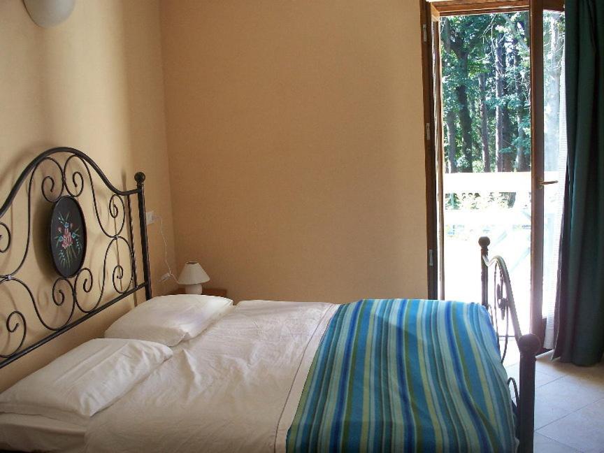 A bed or beds in a room at Agriturismo Monterosso