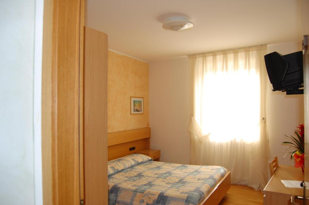 Postel nebo postele na pokoji v ubytování Garni Castel Ferari