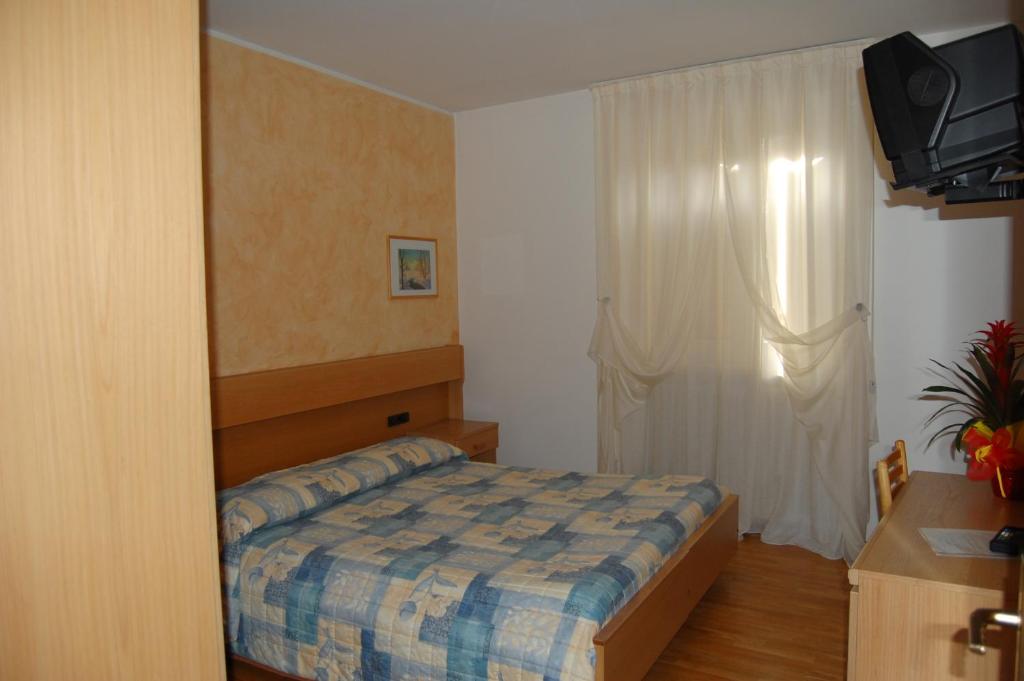 Postel nebo postele na pokoji v ubytování Garni Castel Ferari