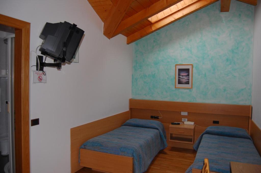 Postel nebo postele na pokoji v ubytování Garni Castel Ferari
