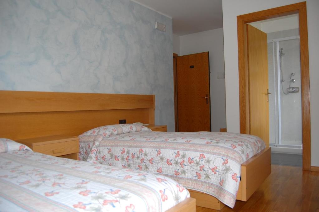 Postel nebo postele na pokoji v ubytování Garni Castel Ferari